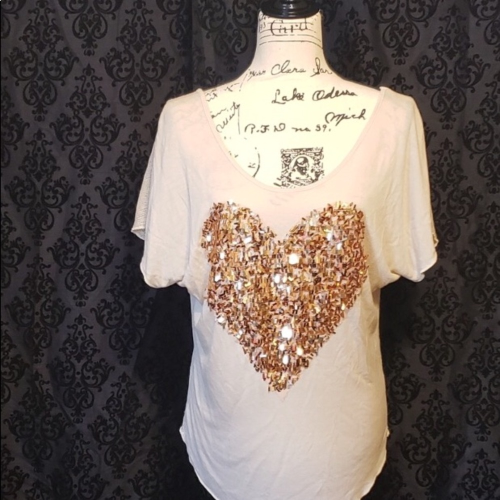 The Clas-sic tee with sequined heart.